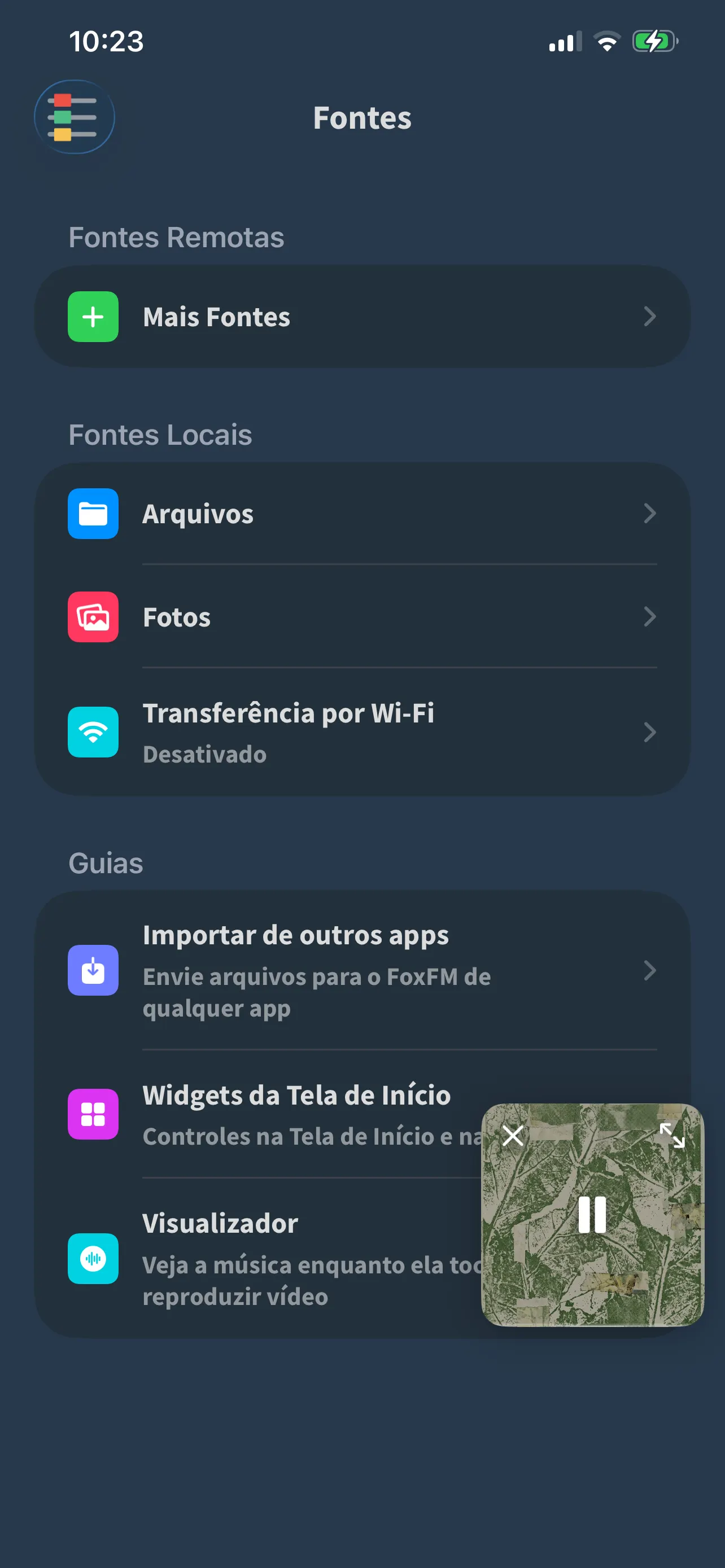 A tela Fontes do FoxFM: Arquivos, Fotos e Transferência por Wi-Fi, com a seção de Guias abaixo