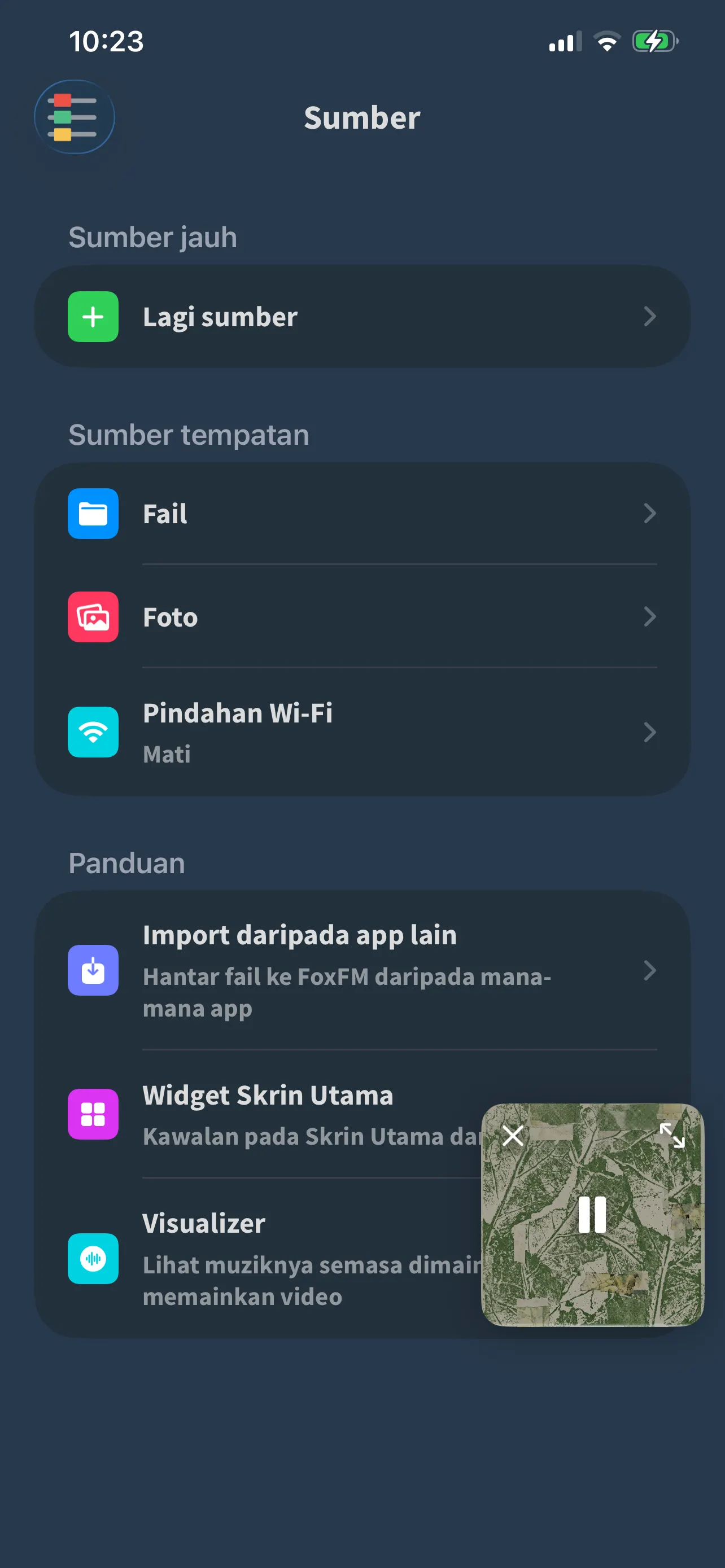 Skrin Sumber dalam FoxFM: Files, Foto dan Pindahan Wi-Fi, dengan bahagian Panduan di bawahnya